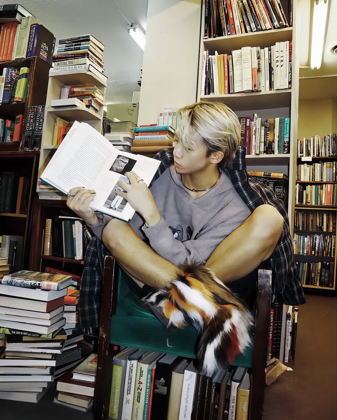 Model portrait among books in an Ottawa shop