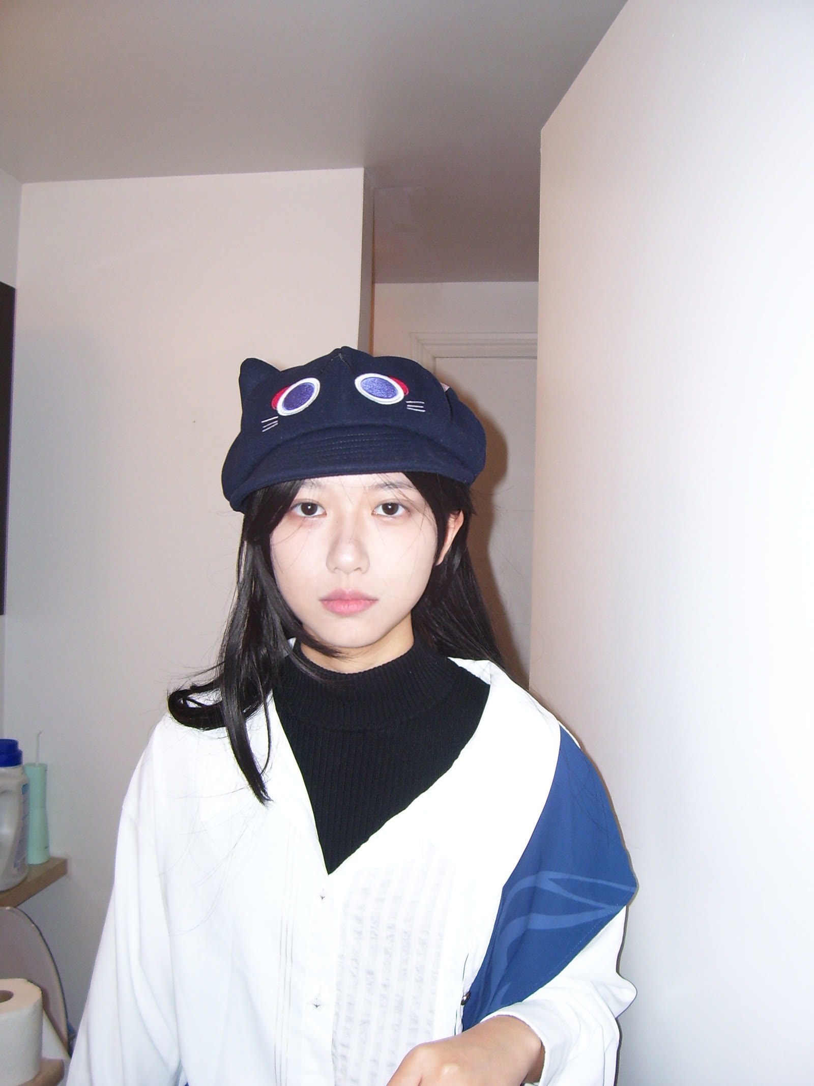 Direct-flash personal portrait wearing a cap