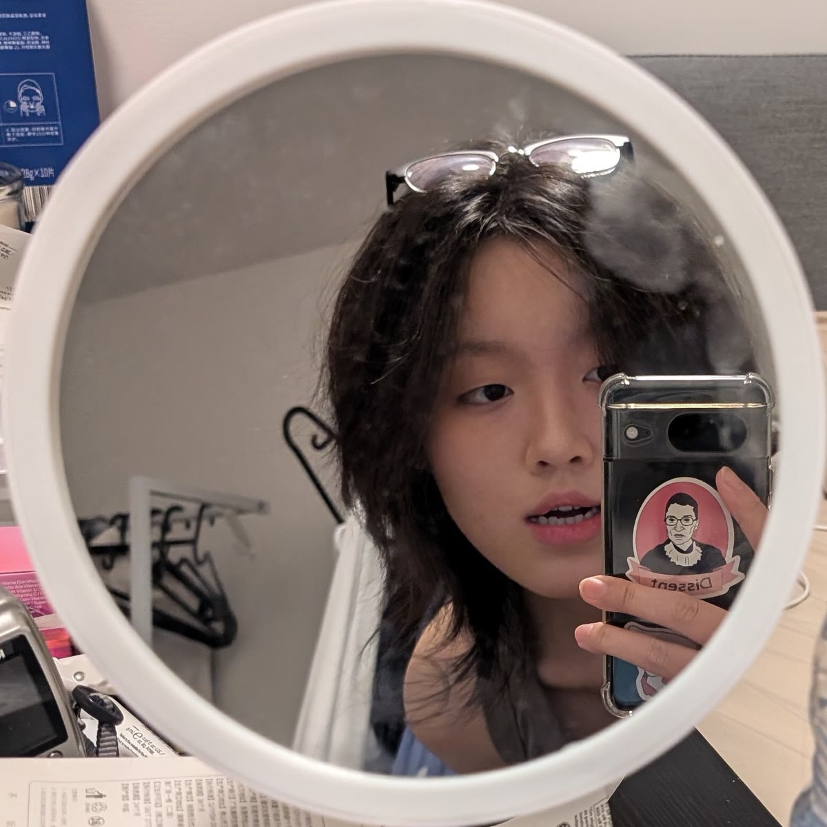 Max Zhang, the photographer behind Lumos Photography, photographed in a mirror